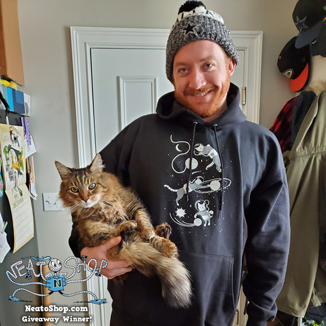 Kylie wearing a cat design hoodie